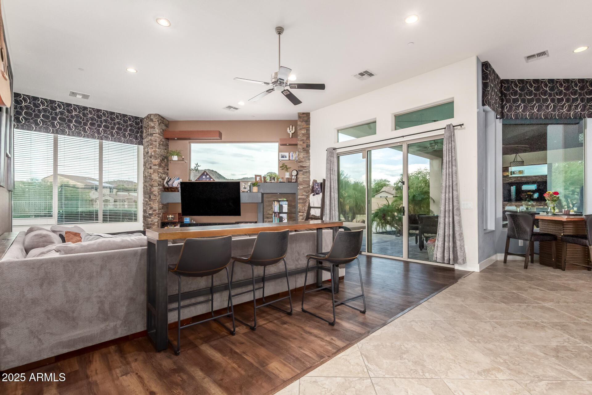 9156 West Bajada Road Peoria, AZ 85383 - Photo 12 of 97 a living room with furniture and a flat screen tv