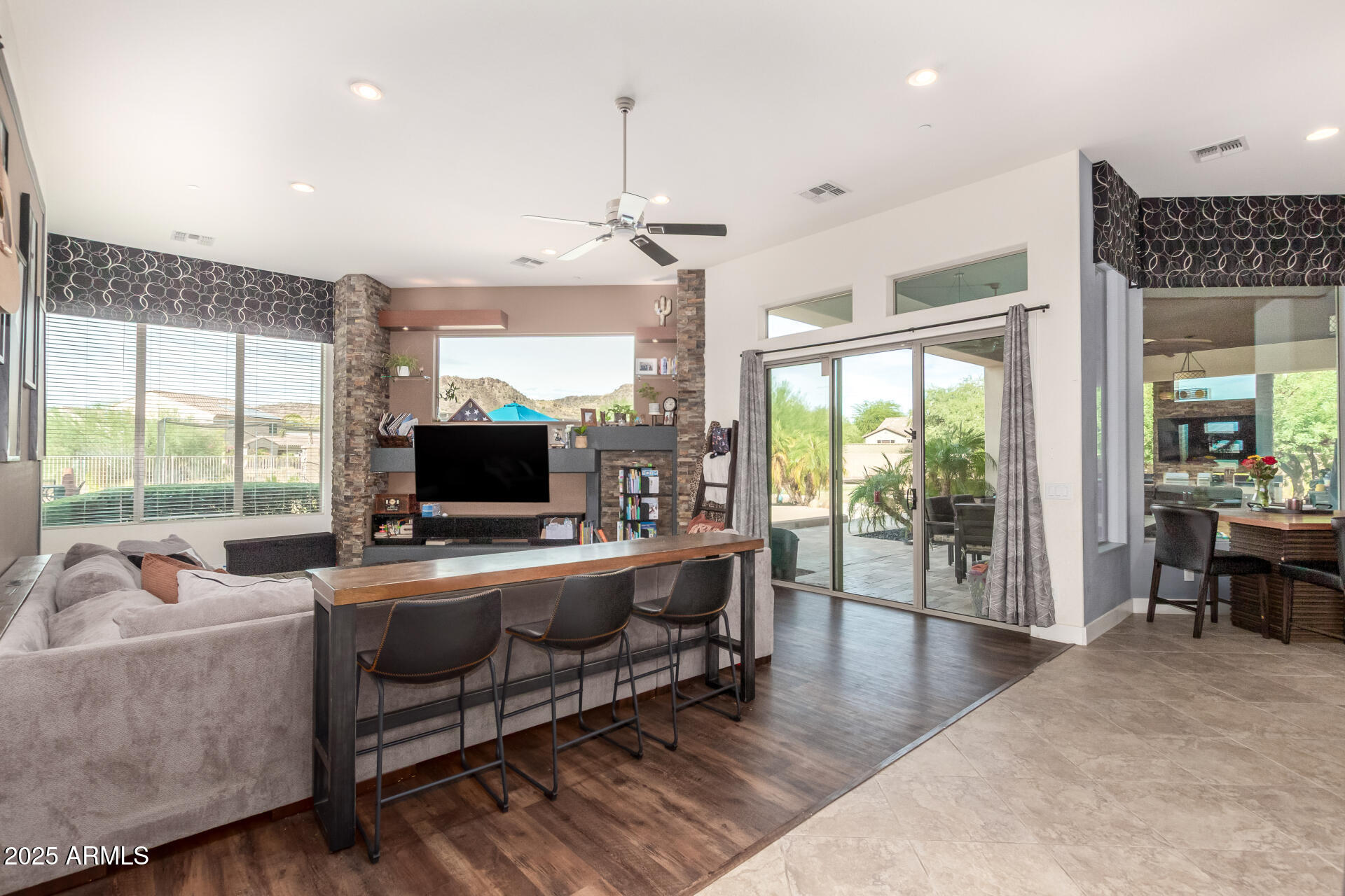 9156 West Bajada Road Peoria, AZ 85383 - Photo 14 of 97 a living room with furniture and a flat screen tv