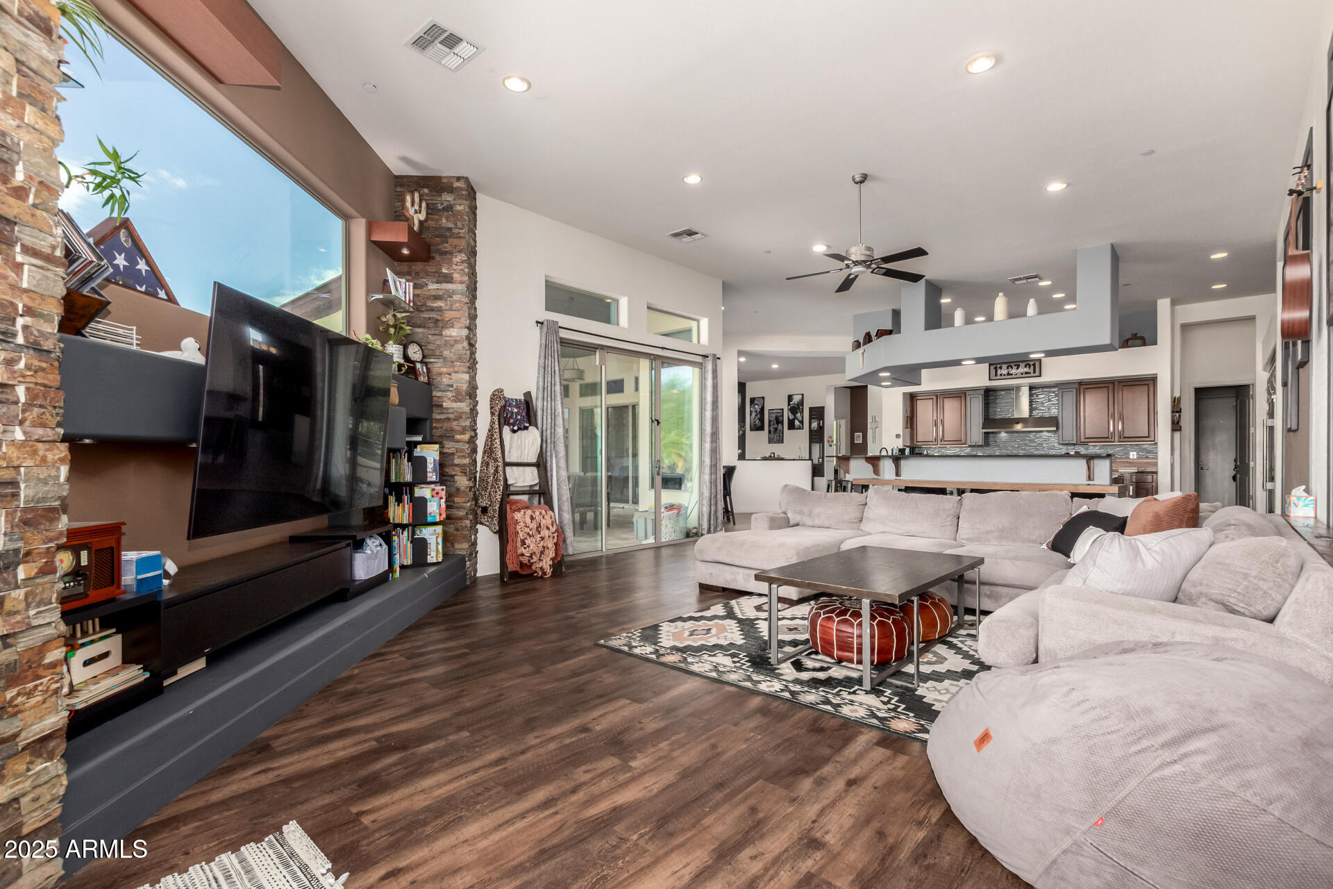 9156 West Bajada Road Peoria, AZ 85383 - Photo 16 of 97 a living room with lots of furniture and a flat screen tv