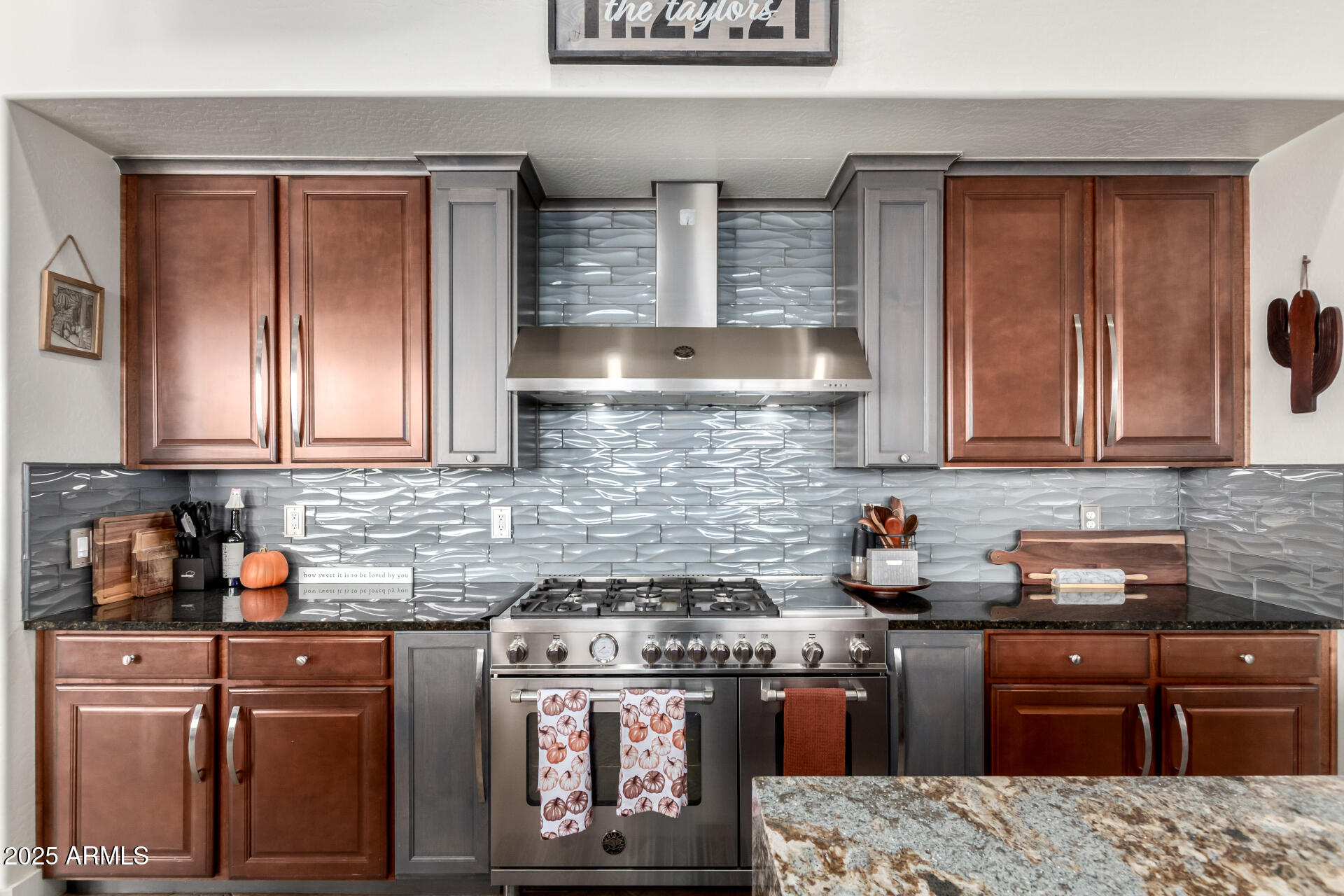9156 West Bajada Road Peoria, AZ 85383 - Photo 22 of 88 a kitchen with stainless steel appliances granite countertop a stove a sink and cabinets