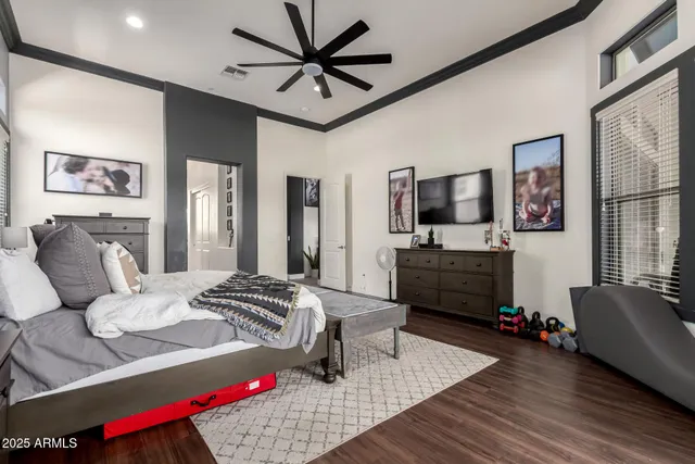 a bathroom with a granite countertop sink a toilet and a large mirror