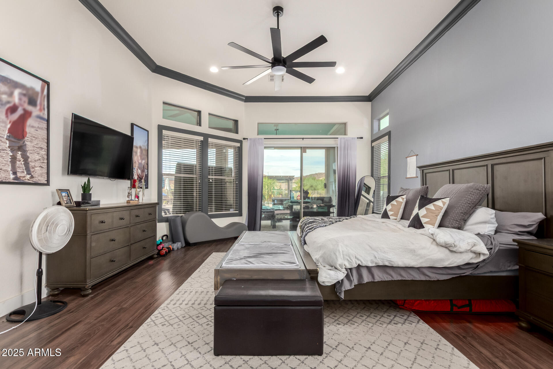 9156 West Bajada Road Peoria, AZ 85383 - Photo 32 of 97 a bedroom with a bed and a flat screen tv