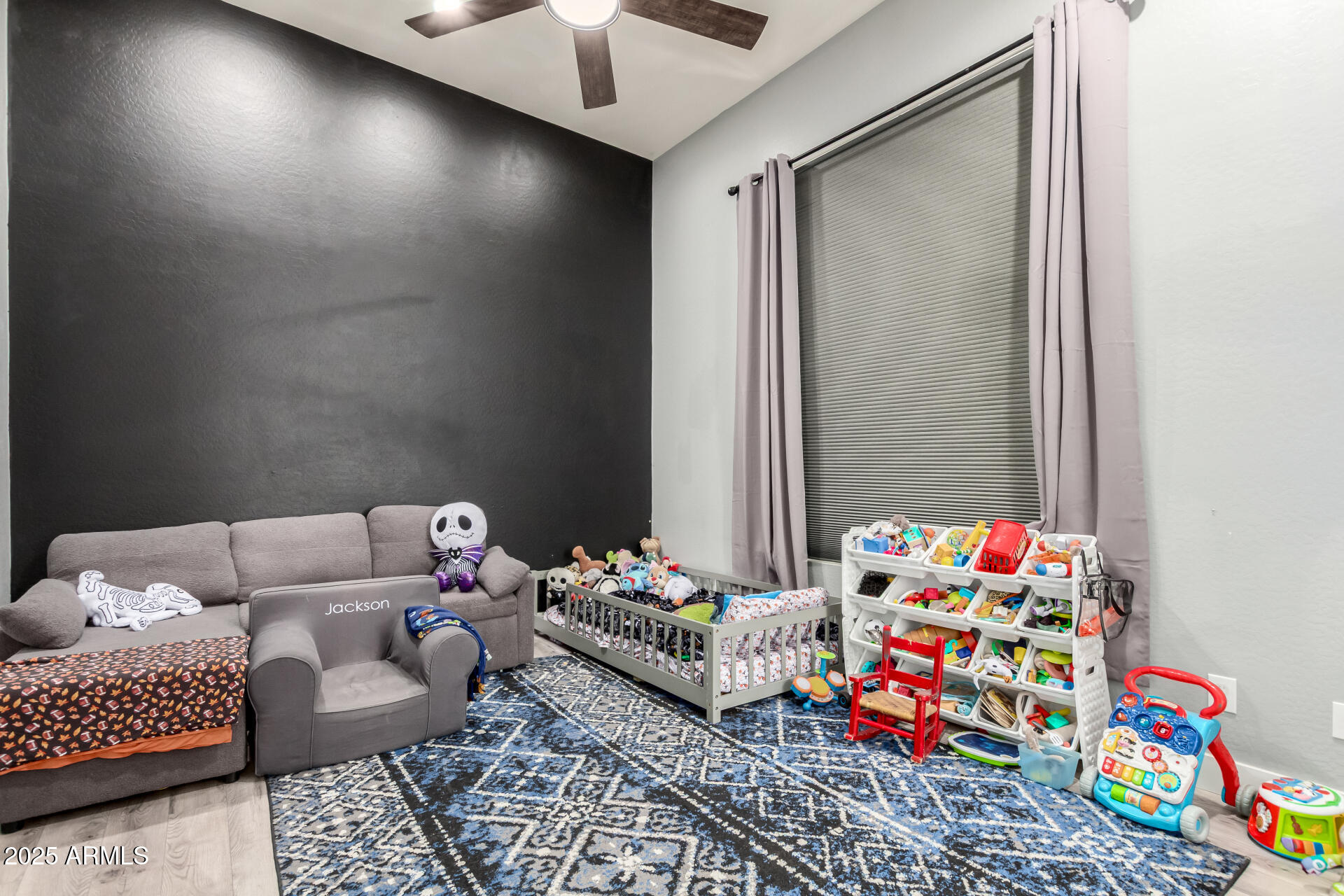 9156 West Bajada Road Peoria, AZ 85383 - Photo 44 of 97 a bedroom with a bed and a couch