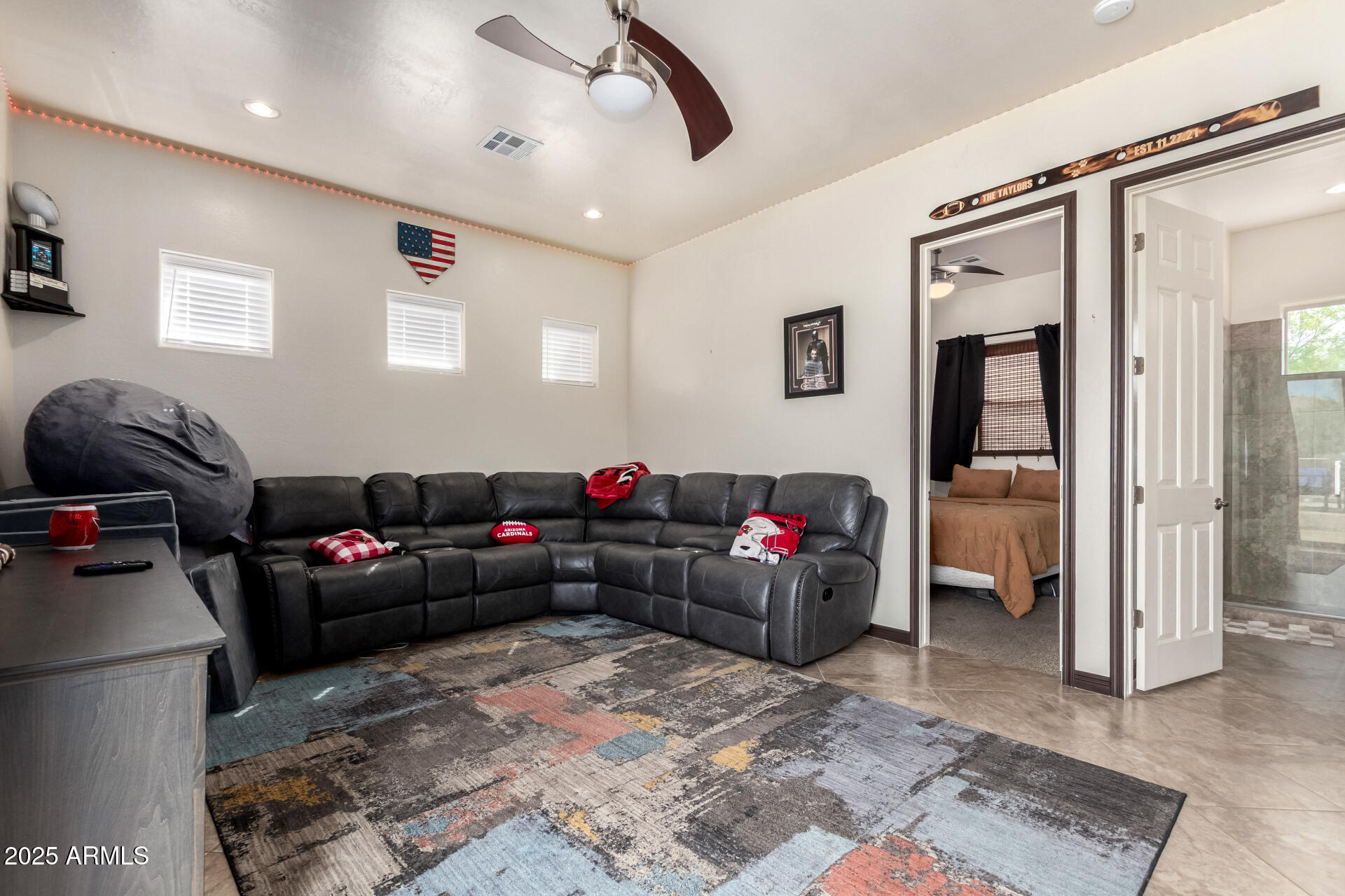 9156 West Bajada Road Peoria, AZ 85383 - Photo 53 of 97 a living room with furniture and a flat screen tv