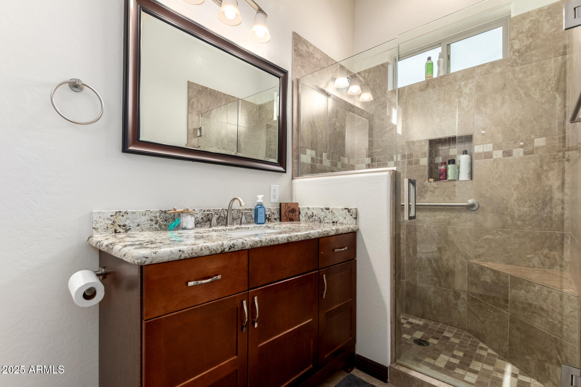 9156 West Bajada Road Peoria, AZ 85383 - Photo 62 of 97 a bathroom with a granite countertop sink a mirror and shower