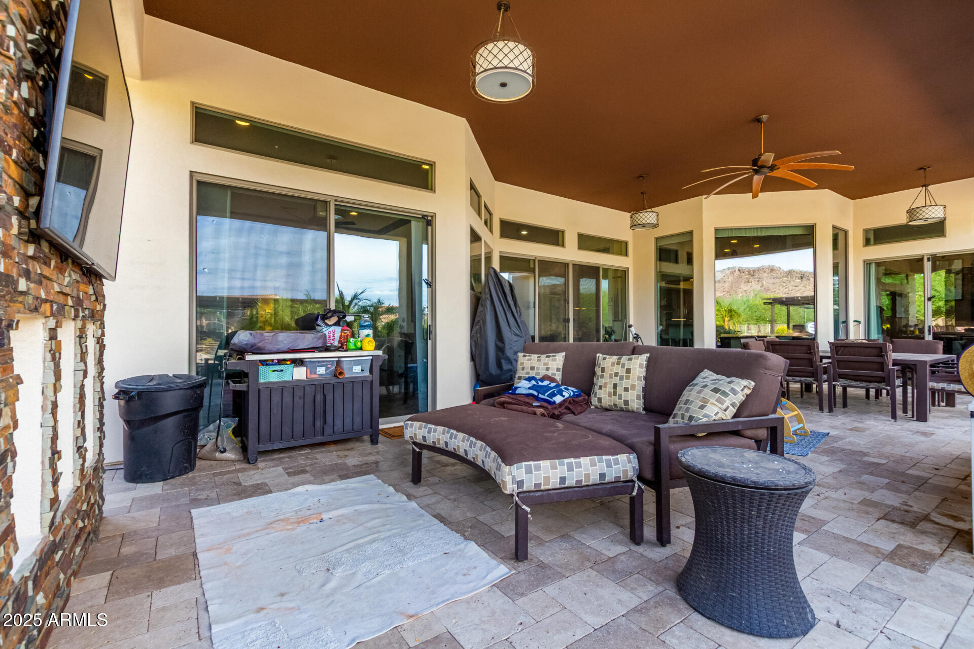 9156 West Bajada Road Peoria, AZ 85383 - Photo 64 of 97 a living room with furniture and a fireplace