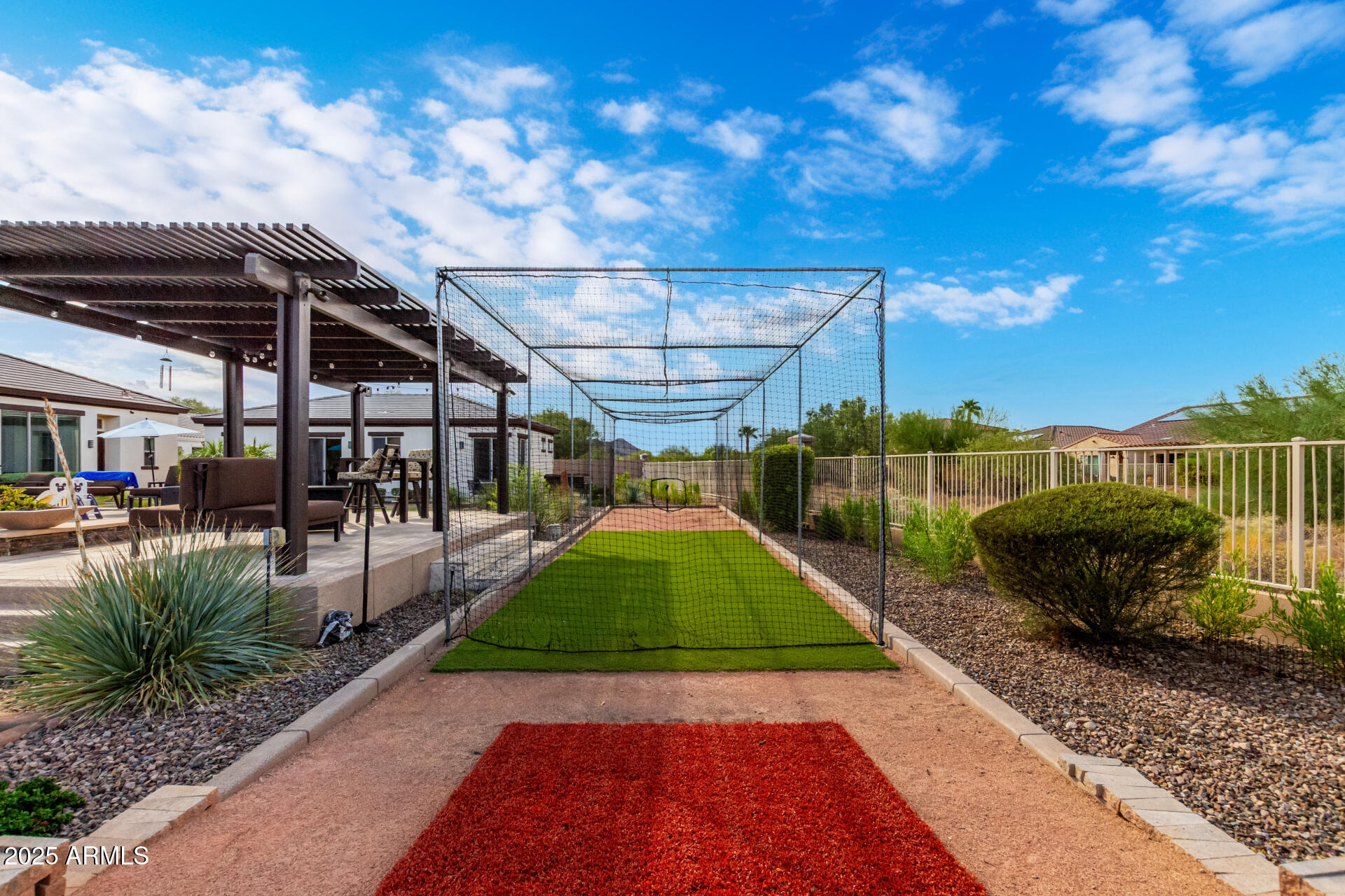 9156 West Bajada Road Peoria, AZ 85383 - Photo 70 of 88 a view of a backyard with couches under an umbrella
