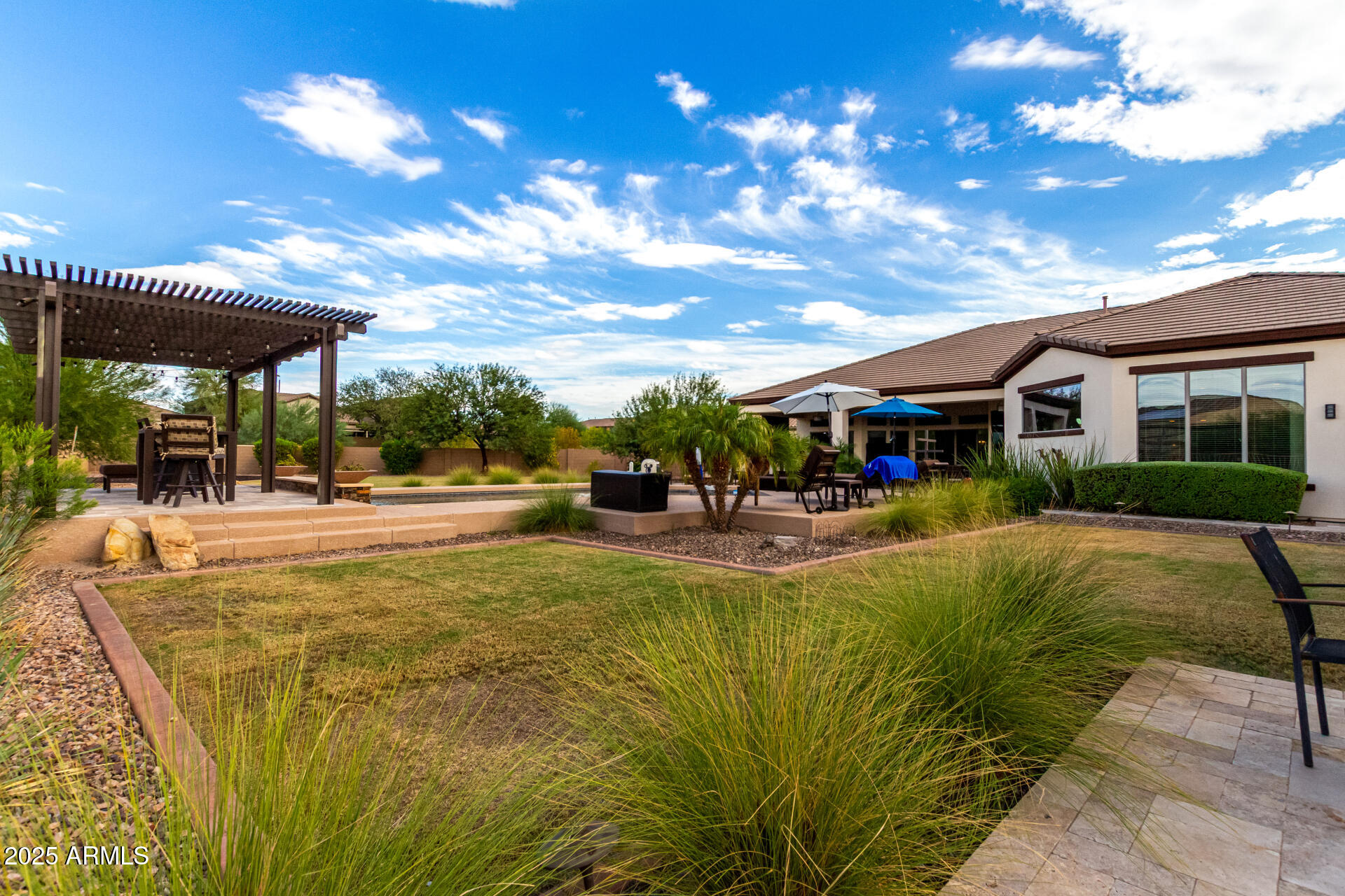 9156 West Bajada Road Peoria, AZ 85383 - Photo 71 of 88 a view of a swimming pool with a patio