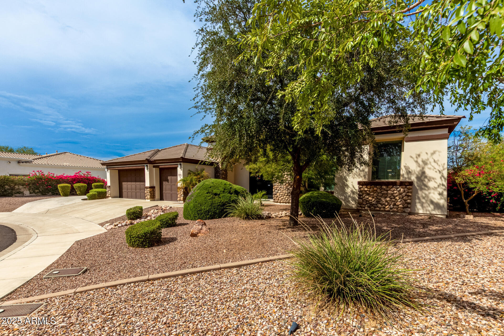9156 West Bajada Road Peoria, AZ 85383 - Photo 6 of 97 a front view of a house with a yard