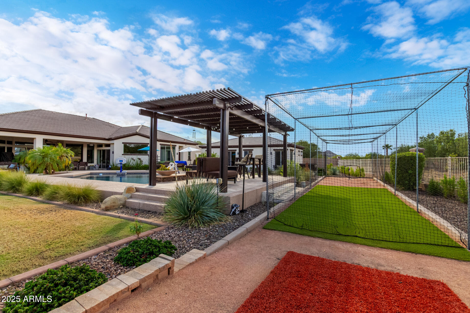 9156 West Bajada Road Peoria, AZ 85383 - Photo 79 of 97 a view of a patio with table and chairs under an umbrella
