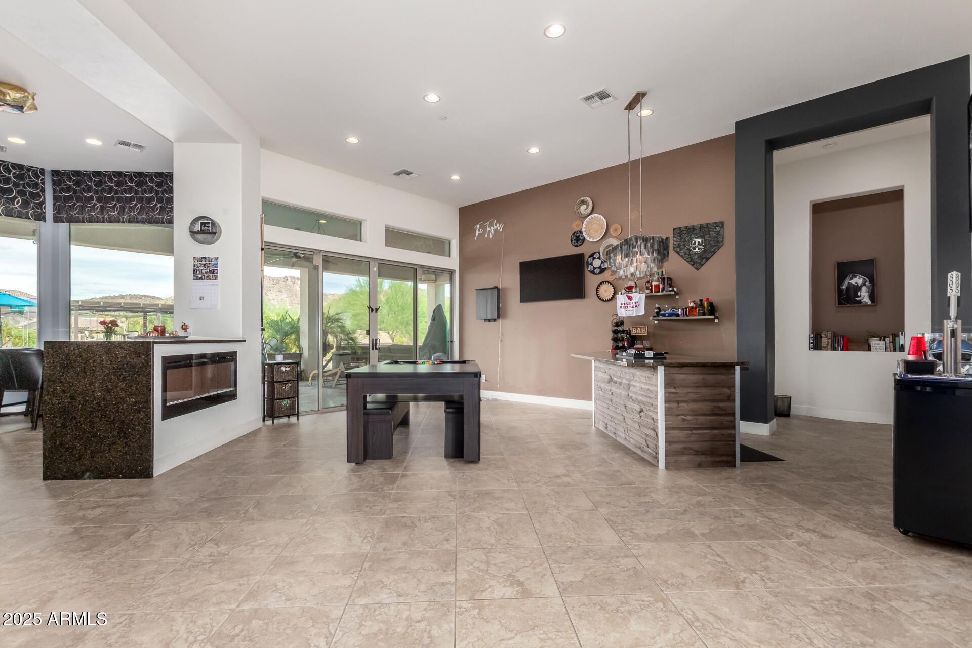 9156 West Bajada Road Peoria, AZ 85383 - Photo 8 of 97 a living room with furniture large window and flat screen tv