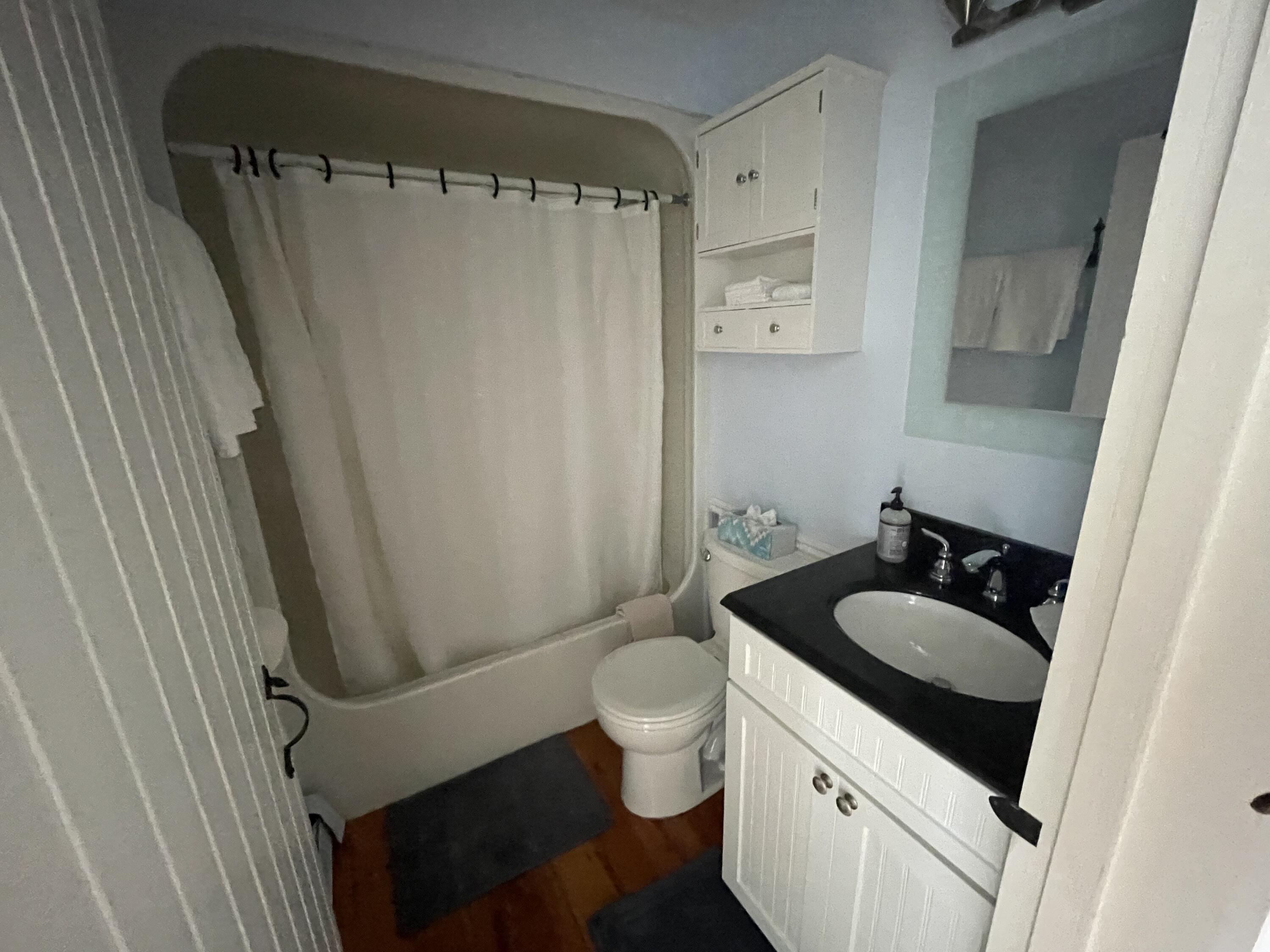 16 Brant Rock Road Mashpee, MA 02649 - Photo 17 of 23 a bathroom with a granite countertop sink toilet and shower