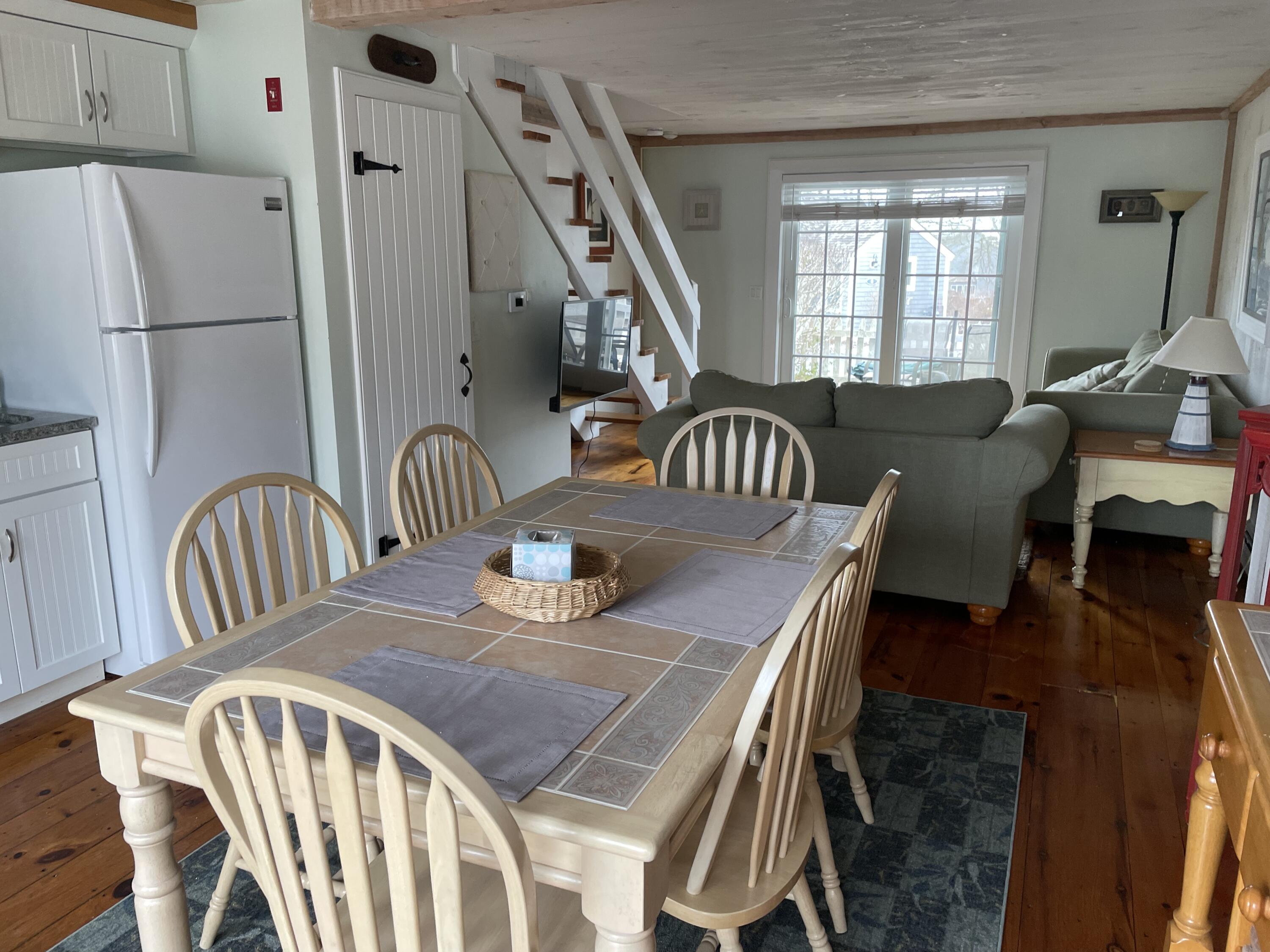 16 Brant Rock Road Mashpee, MA 02649 - Photo 7 of 23 a view of a dining room with furniture