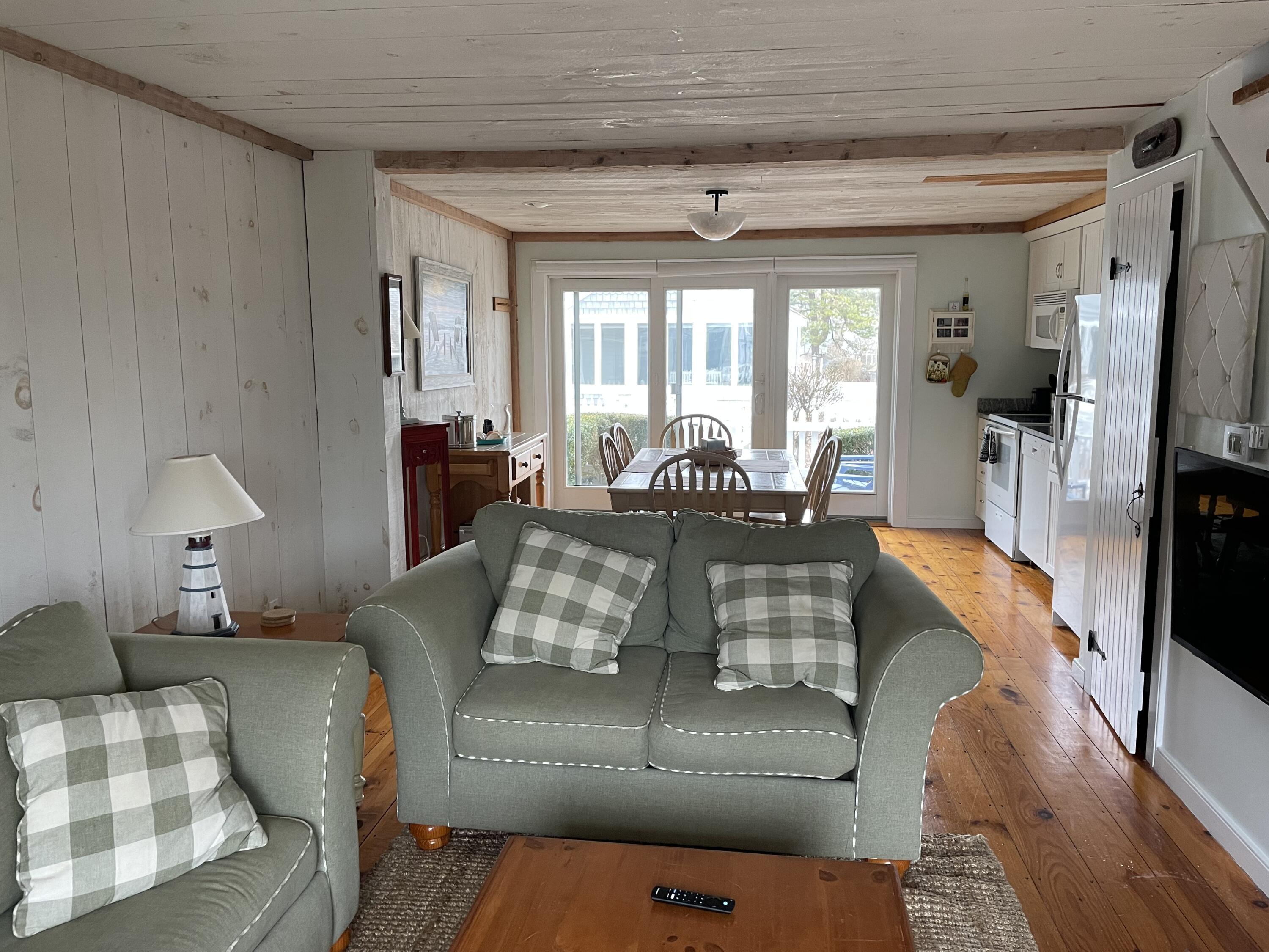 16 Brant Rock Road Mashpee, MA 02649 - Photo 10 of 23 a living room with furniture fireplace and a flat screen tv