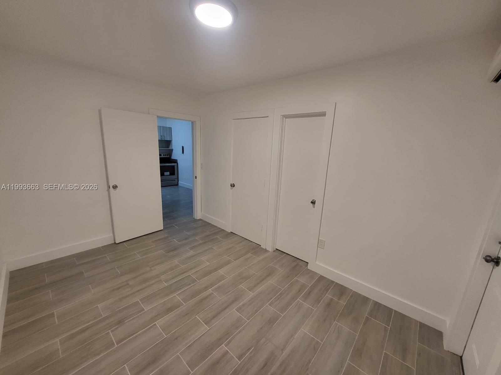 599 Northwest 33rd Street Miami, FL 33127 - Photo 5 of 8 a view of an empty room
