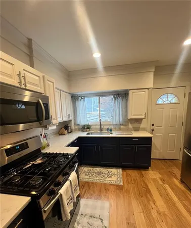 a kitchen with a appliances and cabinets