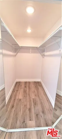 an empty room with wooden floor