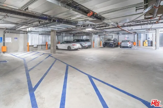 a view of parking garage with cars