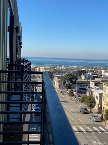 a view of a balcony with wooden floor