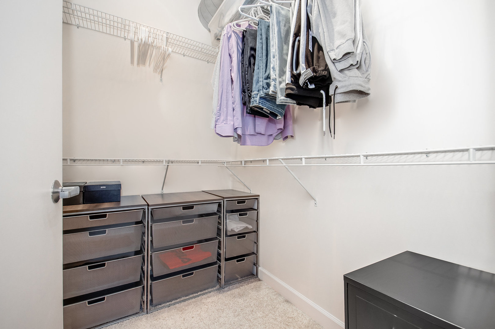 111 South Morgan Street, Unit 416 Chicago, IL 60607 - Photo 13 of 15 a view of walk in closet with clothes and shoes
