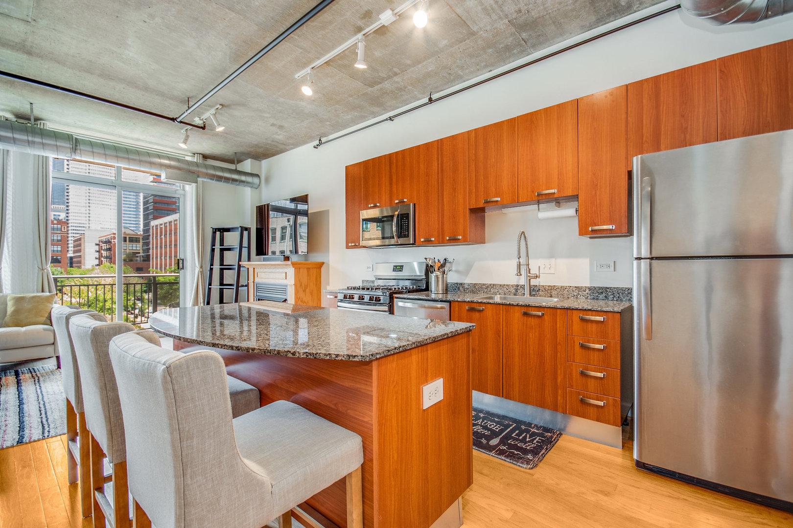 111 South Morgan Street, Unit 416 Chicago, IL 60607 - Photo 3 of 15 a kitchen with stainless steel appliances granite countertop a refrigerator a stove top oven a sink and dishwasher