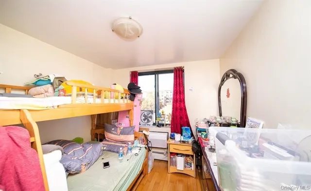 a bed room with a bed and a chandelier