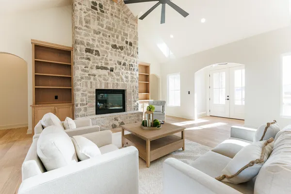 a kitchen with counter top space and living room