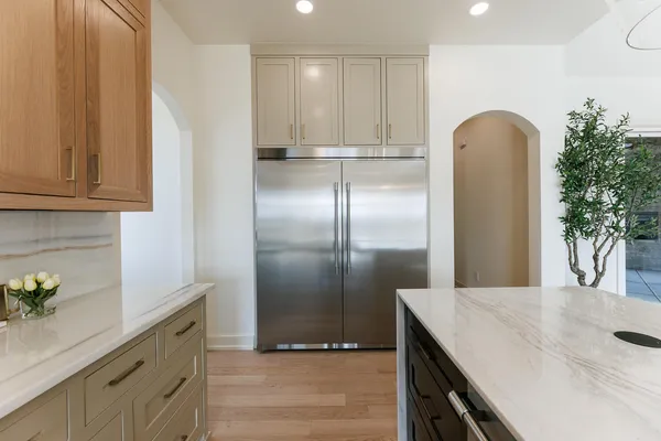 a bathroom with a toilet sink a window and mirror