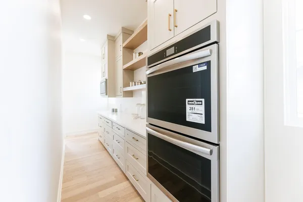 a bathroom with a sink and mirror with toilet