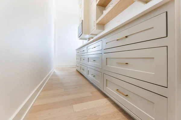 an empty room with a window and a bathroom