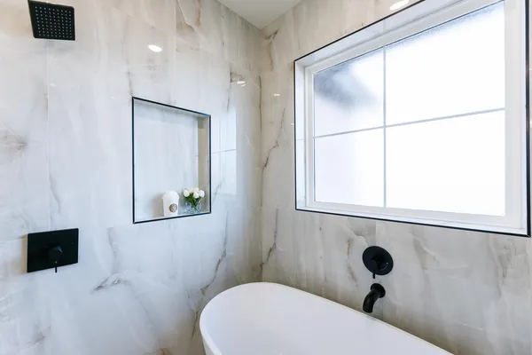 a view of an empty room with a fireplace