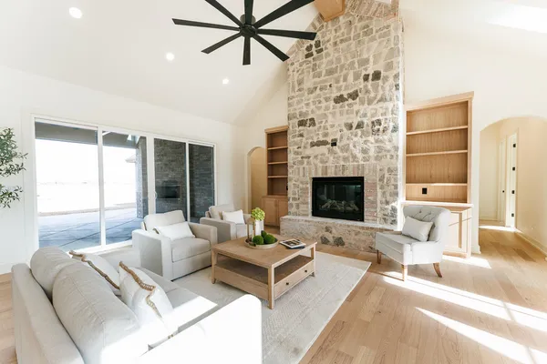 a living room with furniture and a potted plant