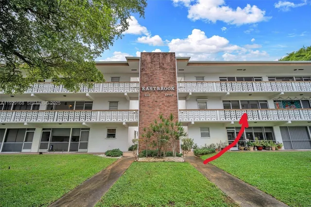 a front view of building with yard