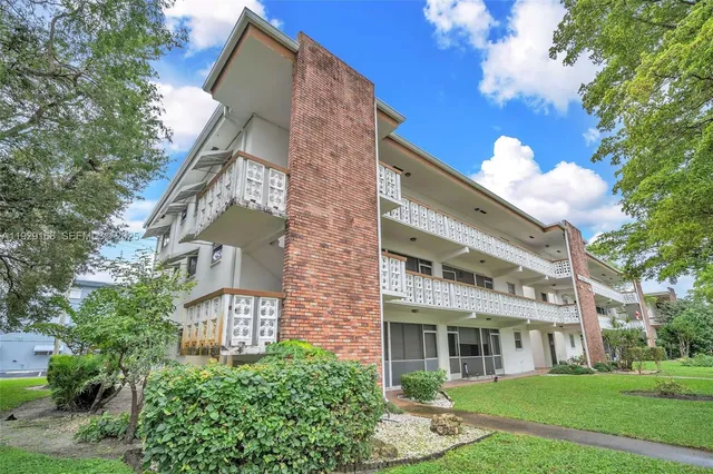 a view of a building with a yard