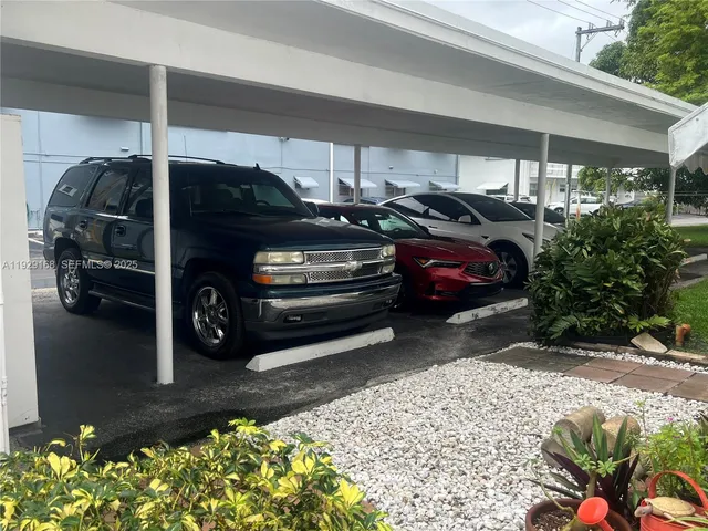 a view of a car in front of a house