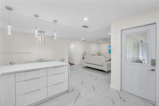 a spacious bathroom with a double vanity sink and a mirror