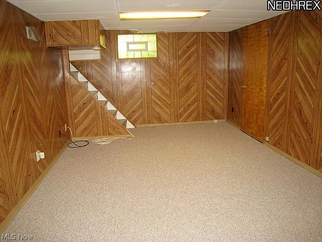 1051 Roanoke Road Cleveland, OH 44121 - Photo 23 of 25 Finished Recreation Room w/New Berber Carpet. Upgraded Panalized Walls. Built-In Bookcase. 1/2 Bath, Furnace(2008), Hot Water Tank(2008) Upgraded Electrical Breaker Box. Utility Tub and Plenty of Storage.
