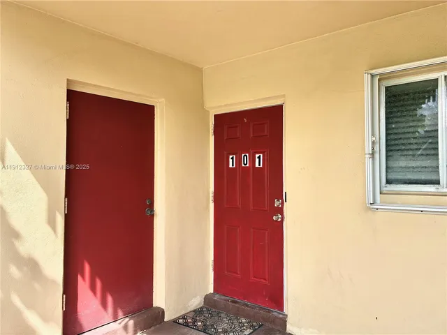 a bathroom with a shower and a sink