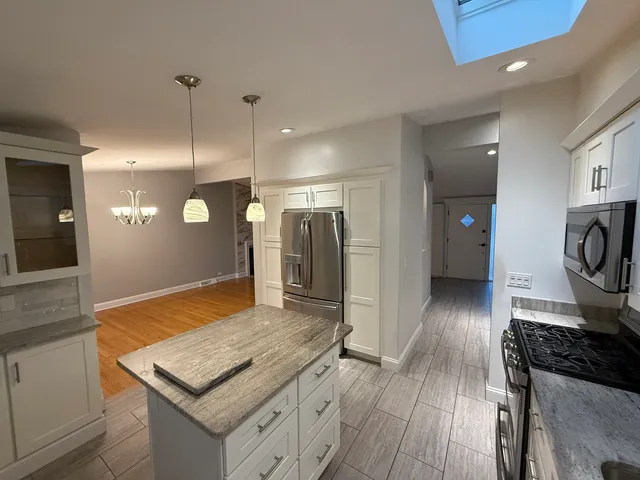 a kitchen with a sink and a stove top oven