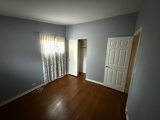 a bathroom with a granite countertop sink toilet a large mirror a bathtub and shower