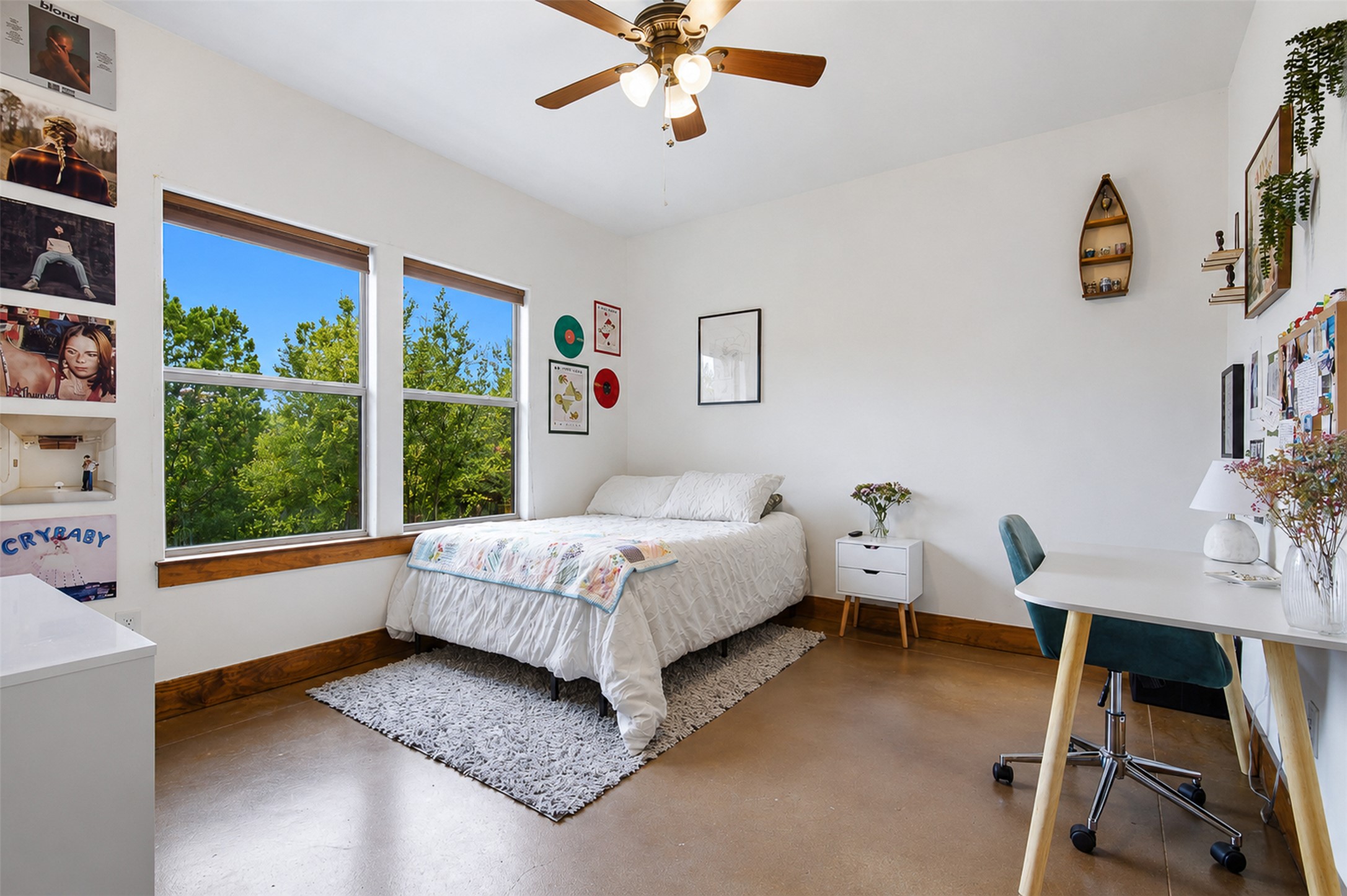 700 Augusta Circle Point Venture, TX 78645 - Photo 13 of 35 A well-lit bedroom with ample natural light from generous windows, perfect for relaxation or study.