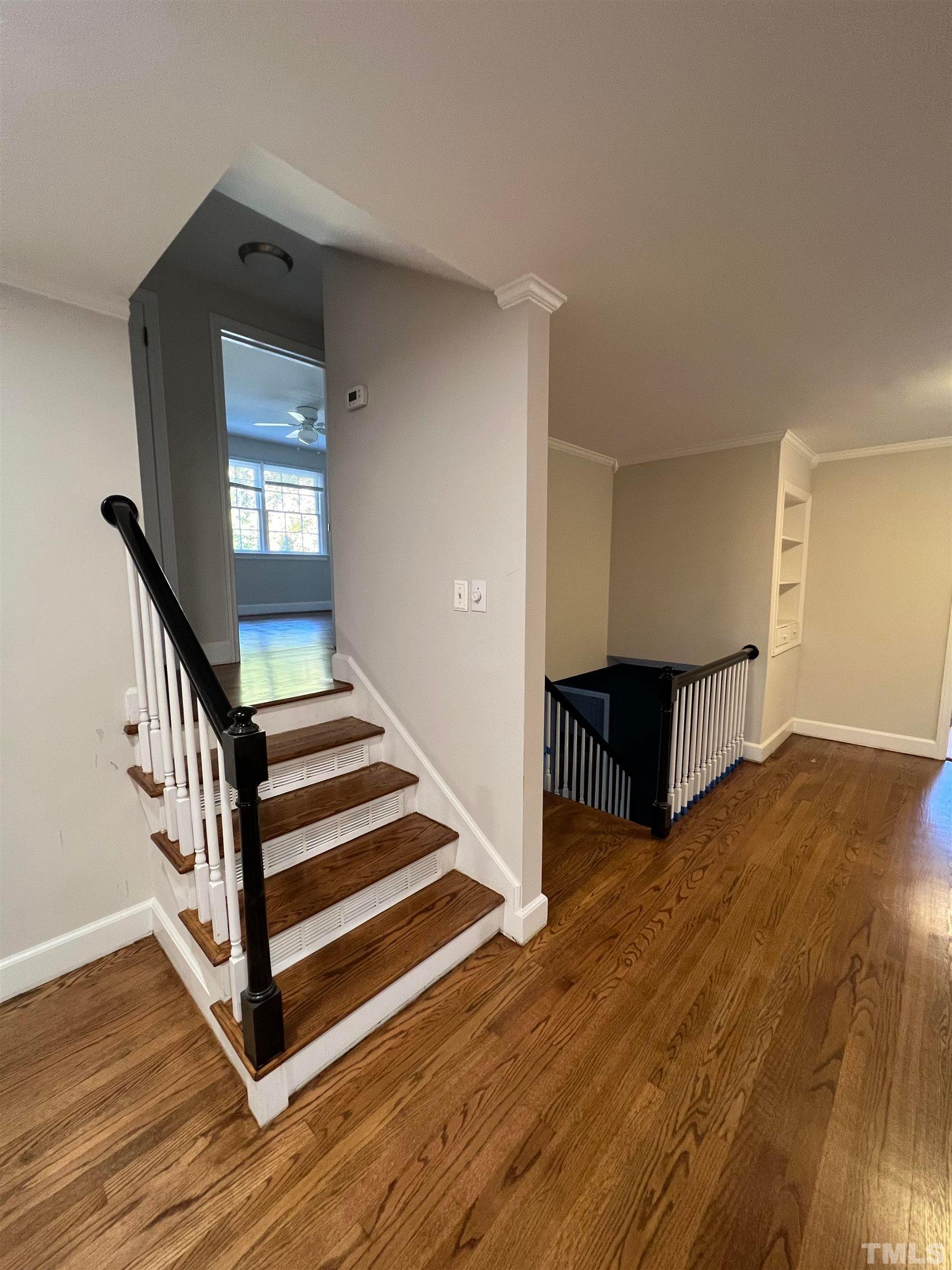 913 Brookwood Drive Raleigh, NC 27607 - Photo 18 of 23 a view of entryway and hall with wooden floor