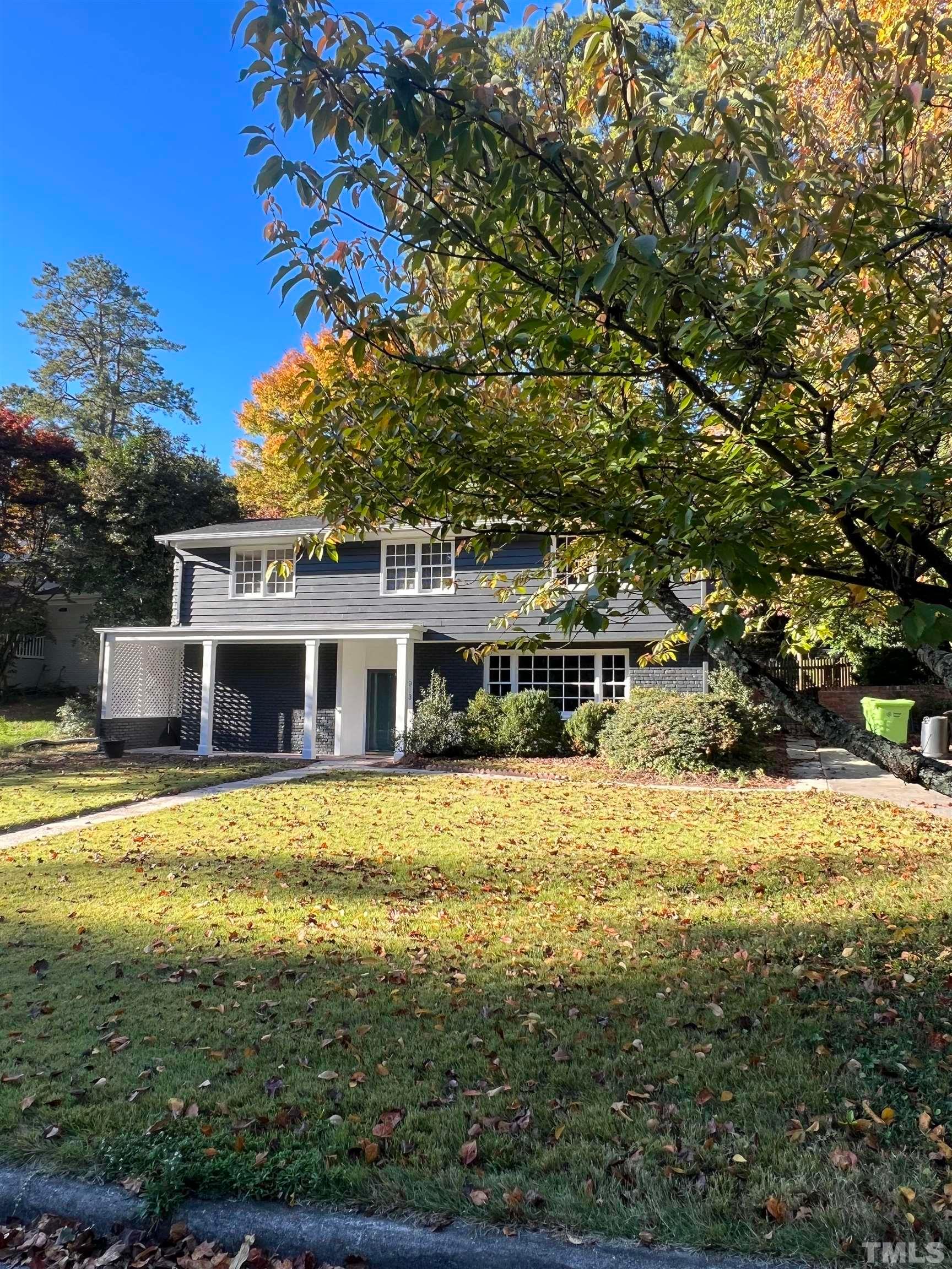 913 Brookwood Drive Raleigh, NC 27607 - Photo 2 of 23 a front view of a house with a garden