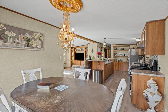 a kitchen with stainless steel appliances granite countertop a stove and a refrigerator