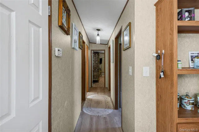 a bathroom with a granite countertop sink toilet a mirror a vanity and shower