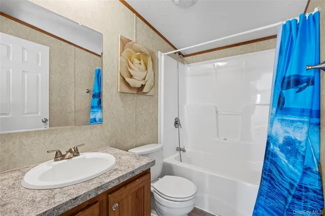 a bedroom with a bed furniture and a window