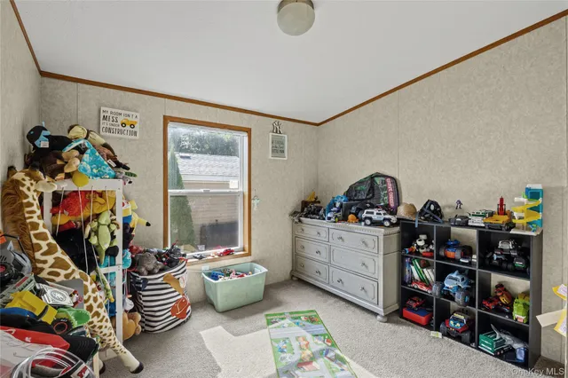 a bedroom with a bed and a large window with outer view