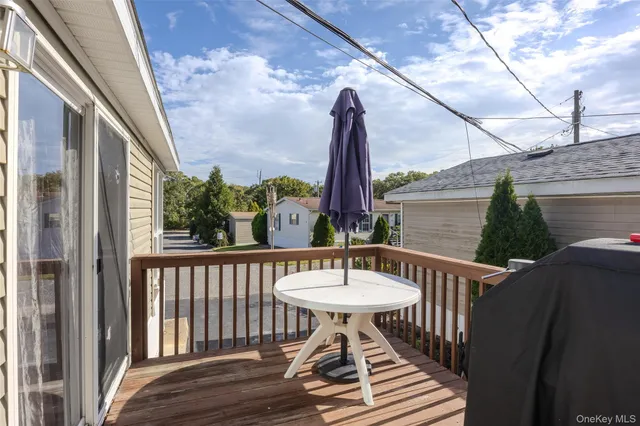 a view of balcony with two chairs and a table