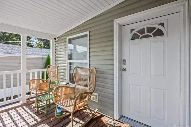 a view of a chair and table in the balcony