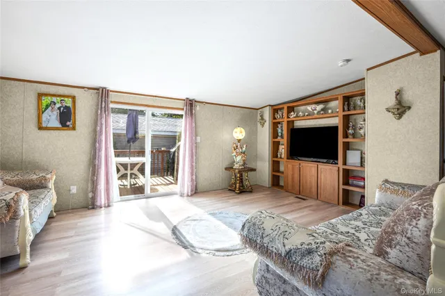 a view of a dining room with furniture wooden floor and chandelier